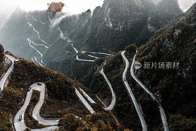 Long slithering curvy mountain road of Zhangjiajie (张家界), on the Tianmen mountain (天门山), China, taken from a helicopter